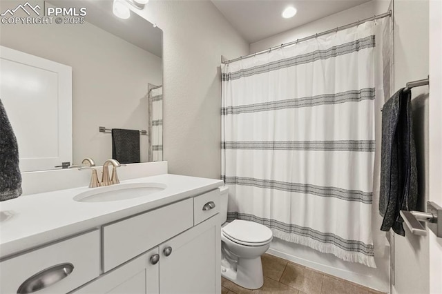 full bathroom featuring toilet, shower / bath combo, vanity, and tile patterned floors