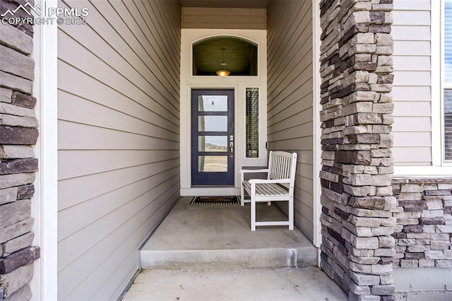 view of exterior entry with stone siding