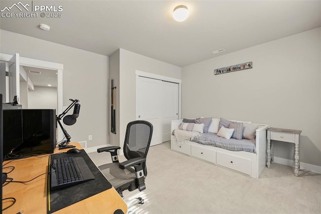 office space featuring carpet floors and baseboards