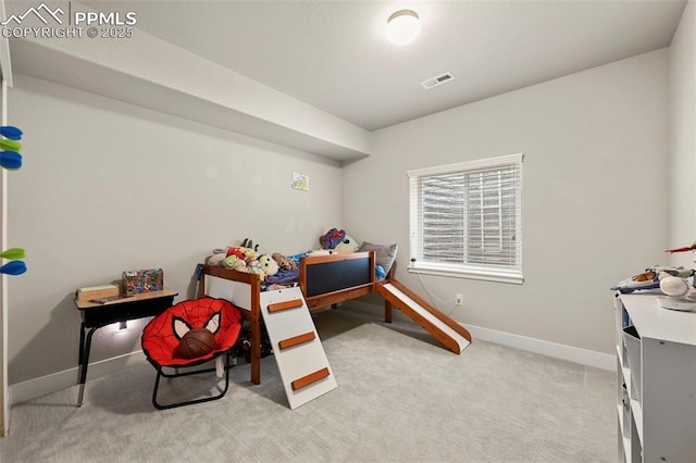 bedroom featuring carpet floors, visible vents, and baseboards