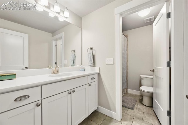 full bath featuring toilet, visible vents, baseboards, vanity, and tile patterned floors