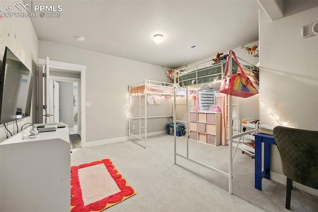 bedroom with carpet floors, visible vents, and baseboards