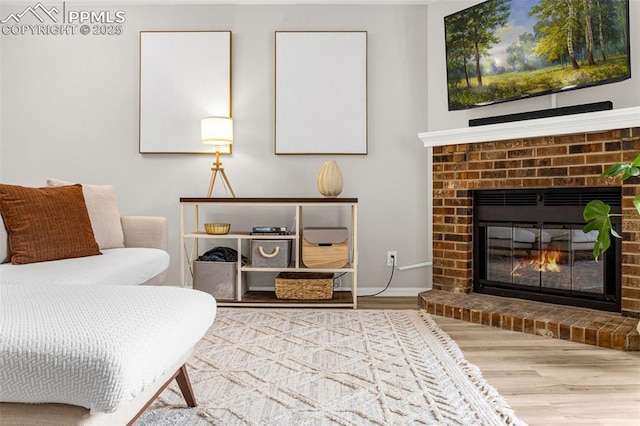 1908 Giltshire Dr, Colorado Springs, CO 80905 - sitting room with baseboards, wood finished floors, and a fireplace