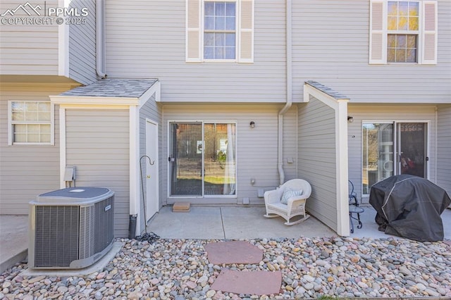 1908 Giltshire Dr, Colorado Springs, CO 80905 - entrance to property with central AC unit, roof with shingles, and a patio area