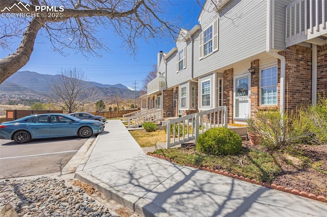 1908 Giltshire Dr, Colorado Springs, CO 80905 - view of side of property featuring uncovered parking and a mountain view