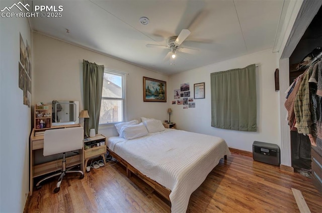 bedroom featuring ceiling fan and wood finished floors