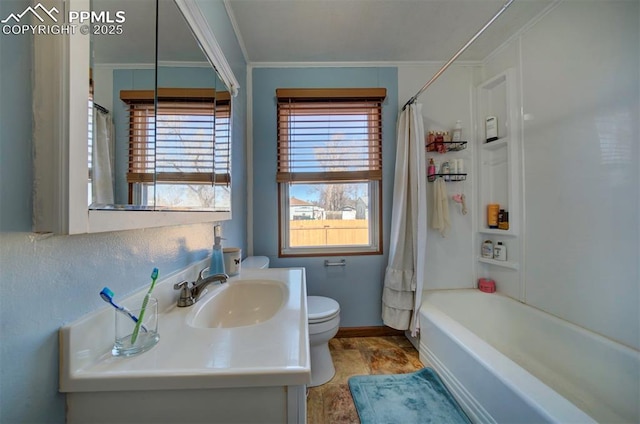 full bath featuring toilet, shower / tub combo, vanity, baseboards, and ornamental molding