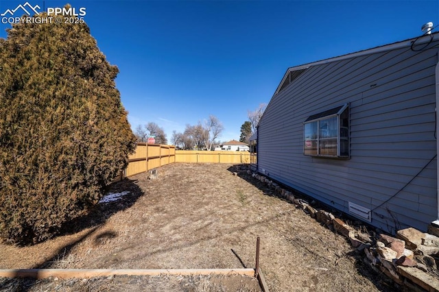 view of yard featuring fence