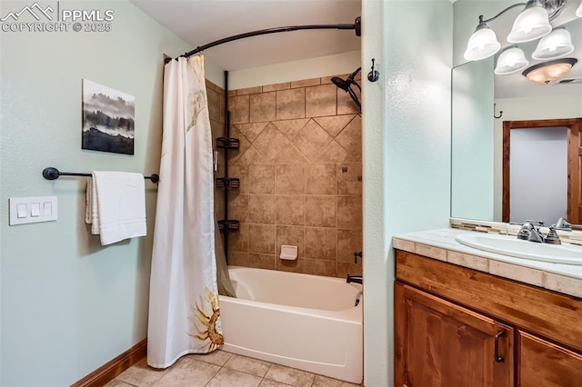 bathroom with baseboards, tile patterned flooring, vanity, and shower / tub combo with curtain