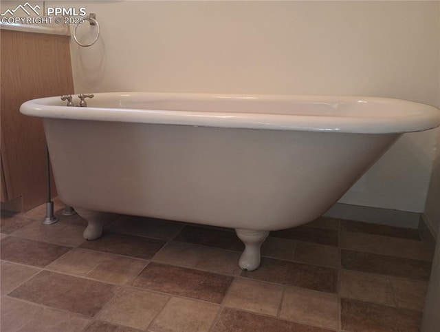 bathroom featuring a freestanding bath