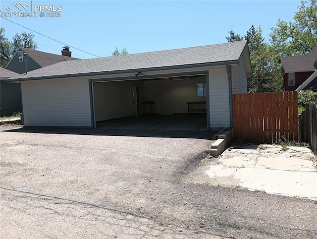 detached garage with fence