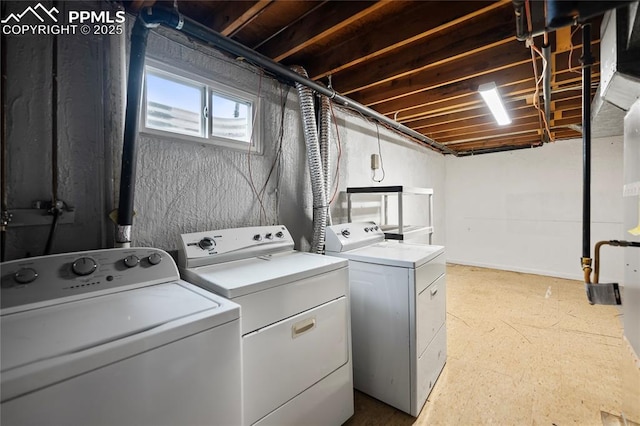 laundry room with laundry area and washing machine and clothes dryer