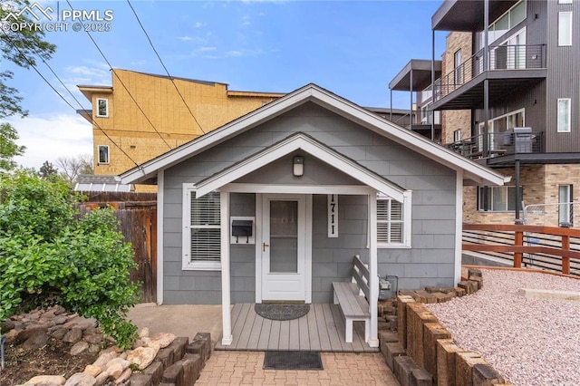 view of front of house featuring fence