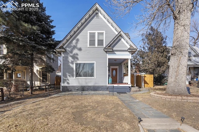 view of front of house featuring fence