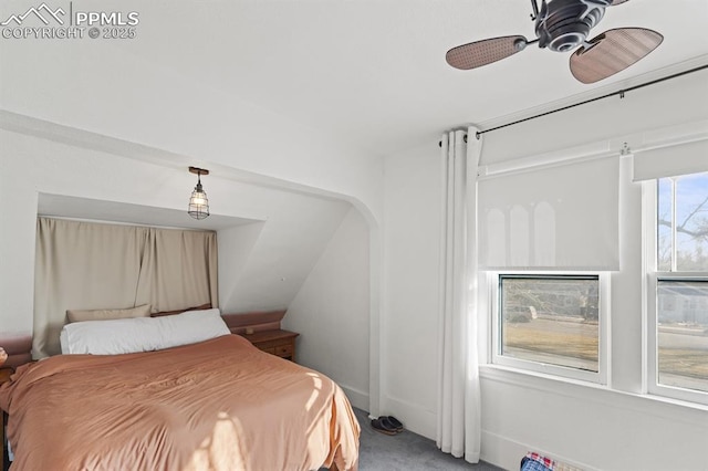 carpeted bedroom featuring ceiling fan and baseboards