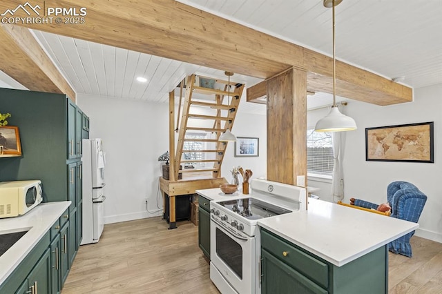 kitchen featuring white appliances, light wood-style flooring, beam ceiling, and green cabinetry