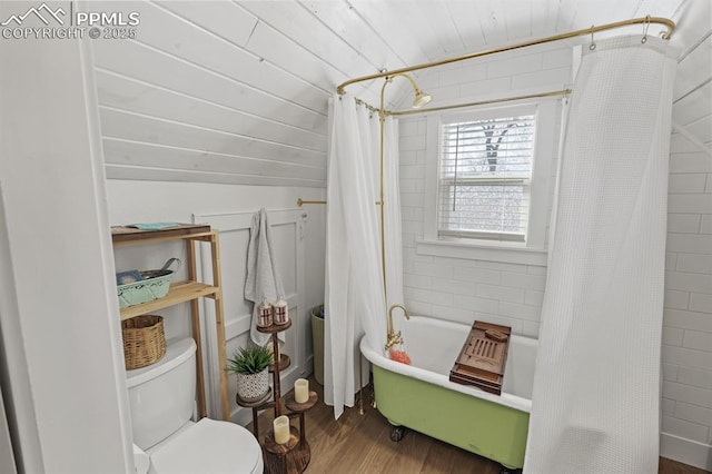 bathroom featuring shower / tub combo, toilet, wood ceiling, wood finished floors, and vaulted ceiling