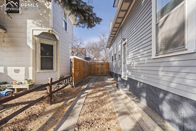 view of property exterior with fence