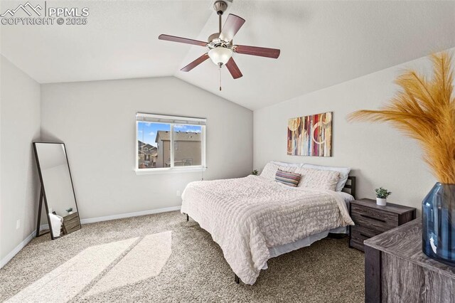 bedroom with vaulted ceiling, carpet floors, a ceiling fan, and baseboards