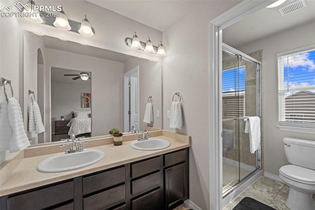 bathroom with toilet, ensuite bath, a sink, and visible vents