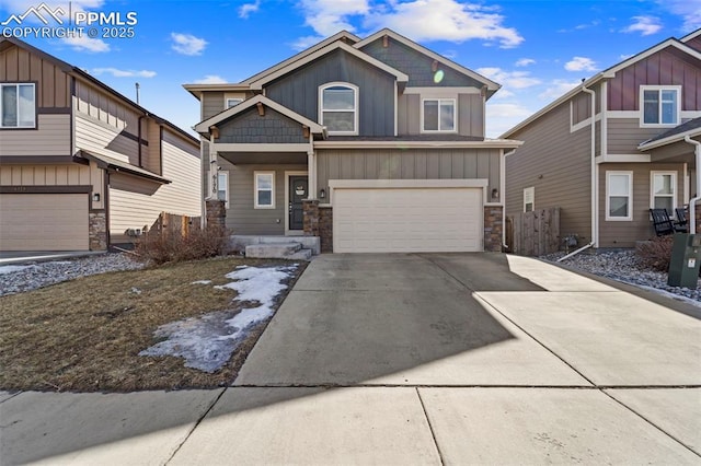 craftsman-style house with a garage, stone siding, board and batten siding, and concrete driveway