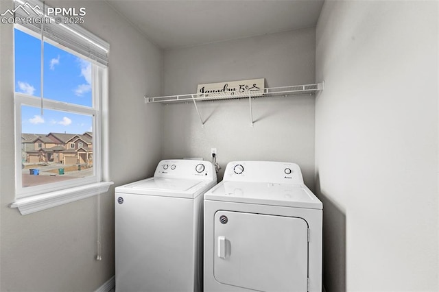 laundry area with laundry area and independent washer and dryer