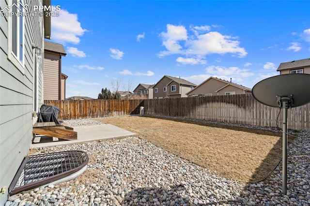 view of yard with a fenced backyard and a patio