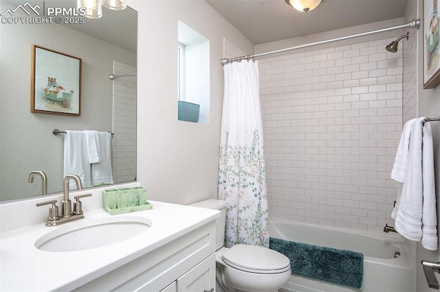 bathroom featuring toilet, shower / tub combo with curtain, and vanity