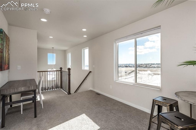 interior space with visible vents, baseboards, and recessed lighting