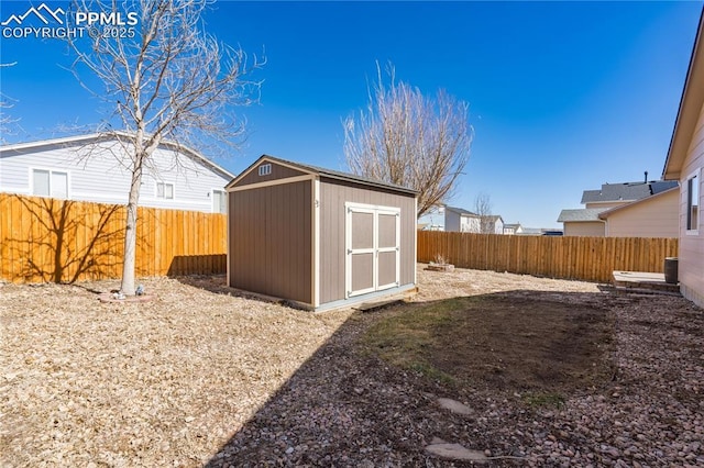 view of shed with a fenced backyard