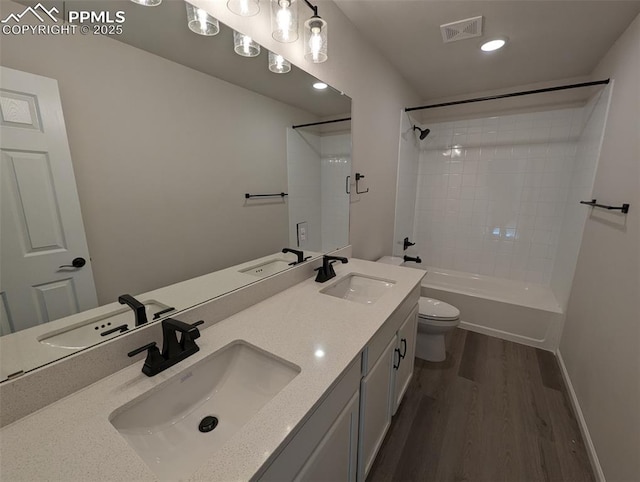 full bathroom with visible vents and a sink