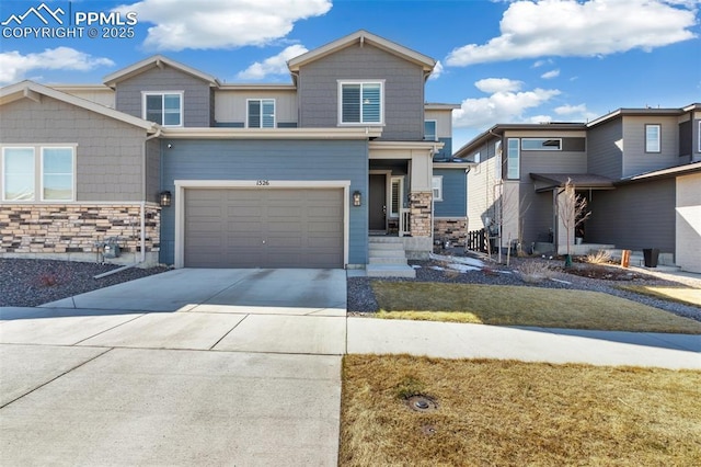 view of front of home featuring concrete driveway, a garage, and stone siding