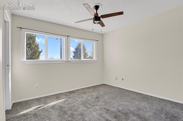 unfurnished room with carpet floors, a healthy amount of sunlight, baseboards, and a textured ceiling