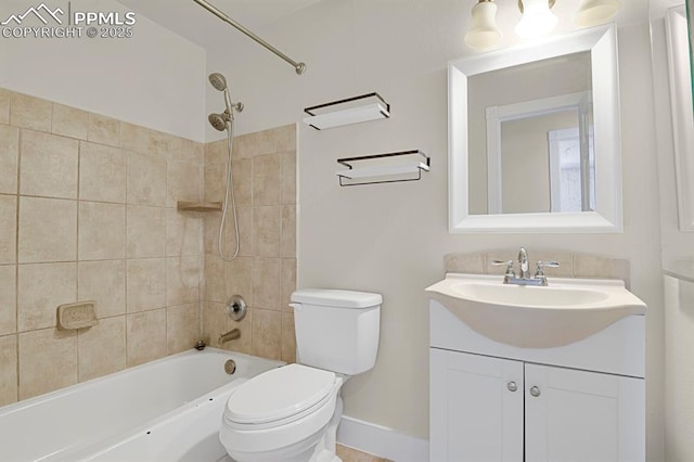 bathroom featuring toilet, bathtub / shower combination, baseboards, and vanity