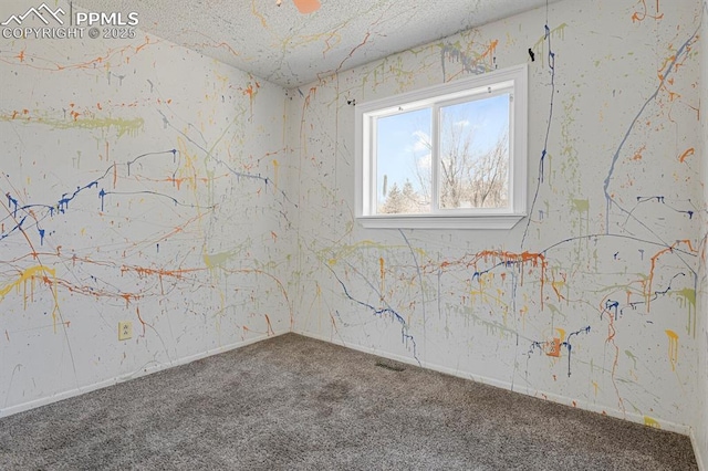 carpeted spare room featuring visible vents