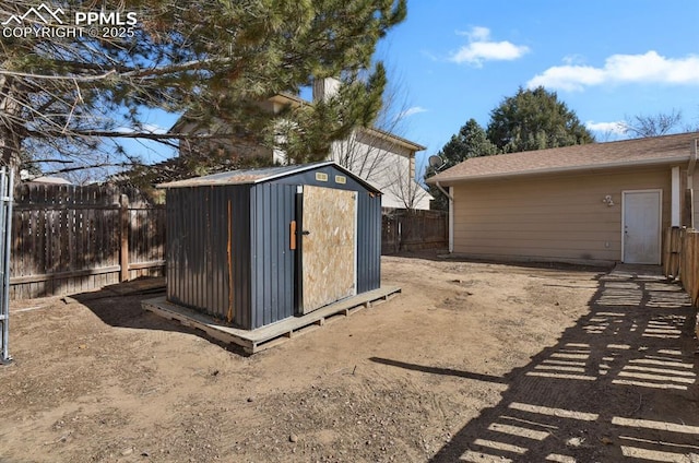 view of shed with a fenced backyard