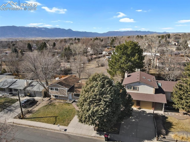 birds eye view of property with a mountain view