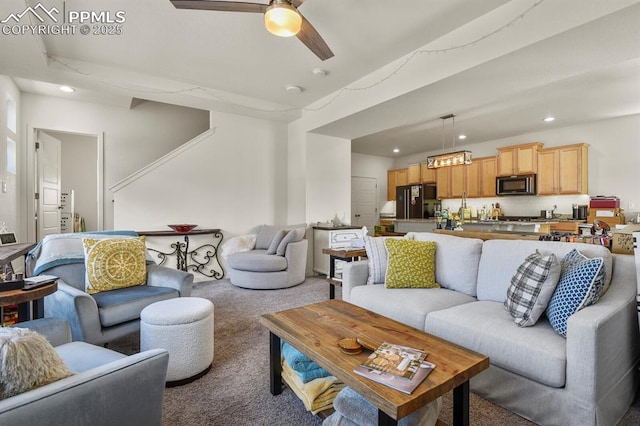 carpeted living area featuring recessed lighting and ceiling fan