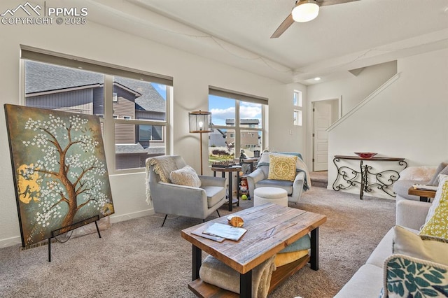 living room with carpet flooring, ceiling fan, and baseboards