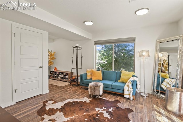 sitting room featuring wood finished floors and baseboards