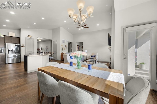 dining room featuring lofted ceiling, recessed lighting, and dark wood-style floors