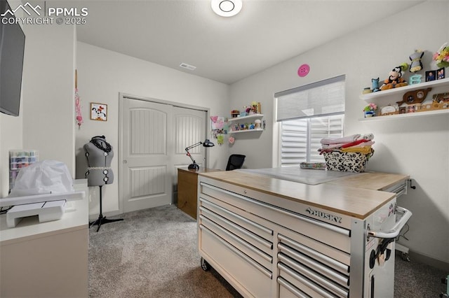 office area with baseboards, visible vents, and carpet floors