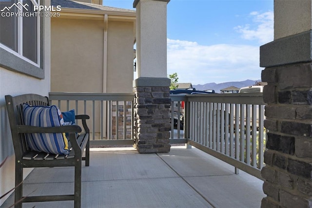 balcony featuring a mountain view