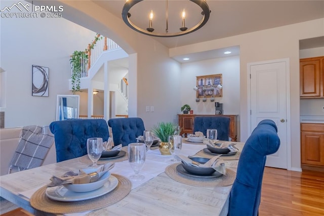 dining room with light wood-style flooring and recessed lighting