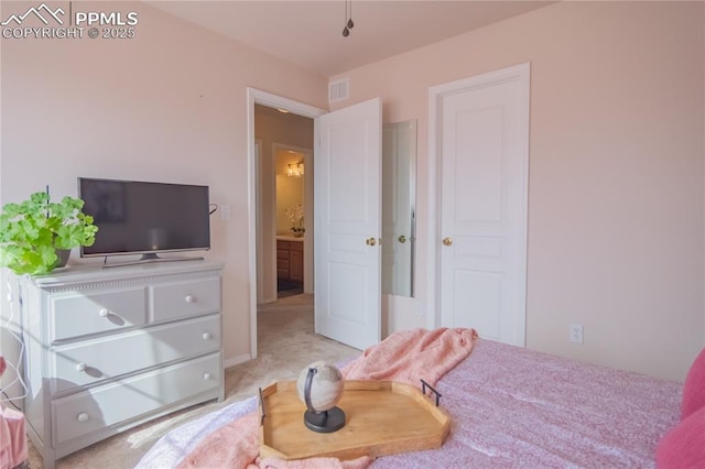 bedroom featuring light colored carpet and visible vents