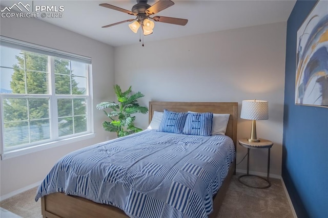 bedroom featuring carpet floors, baseboards, and a ceiling fan