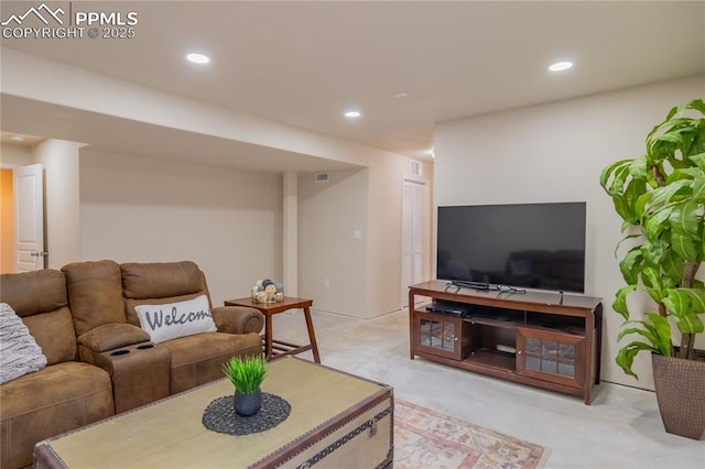 living room featuring recessed lighting and concrete floors