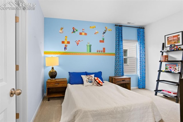 carpeted bedroom featuring baseboards and visible vents