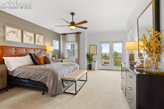 bedroom with light carpet, access to outside, and a ceiling fan