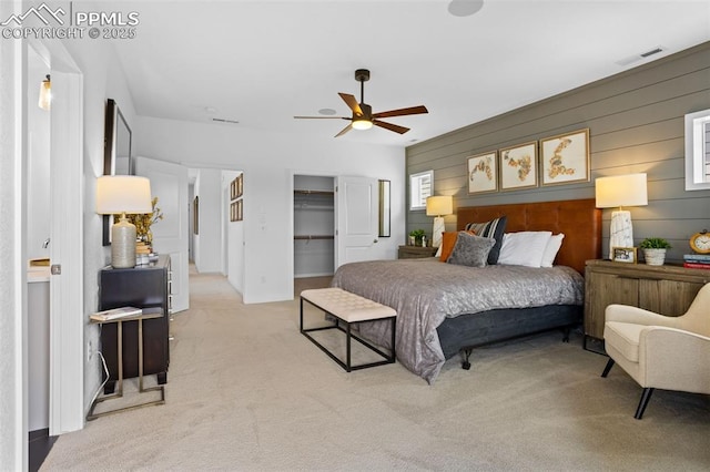 bedroom featuring carpet floors, visible vents, and a ceiling fan